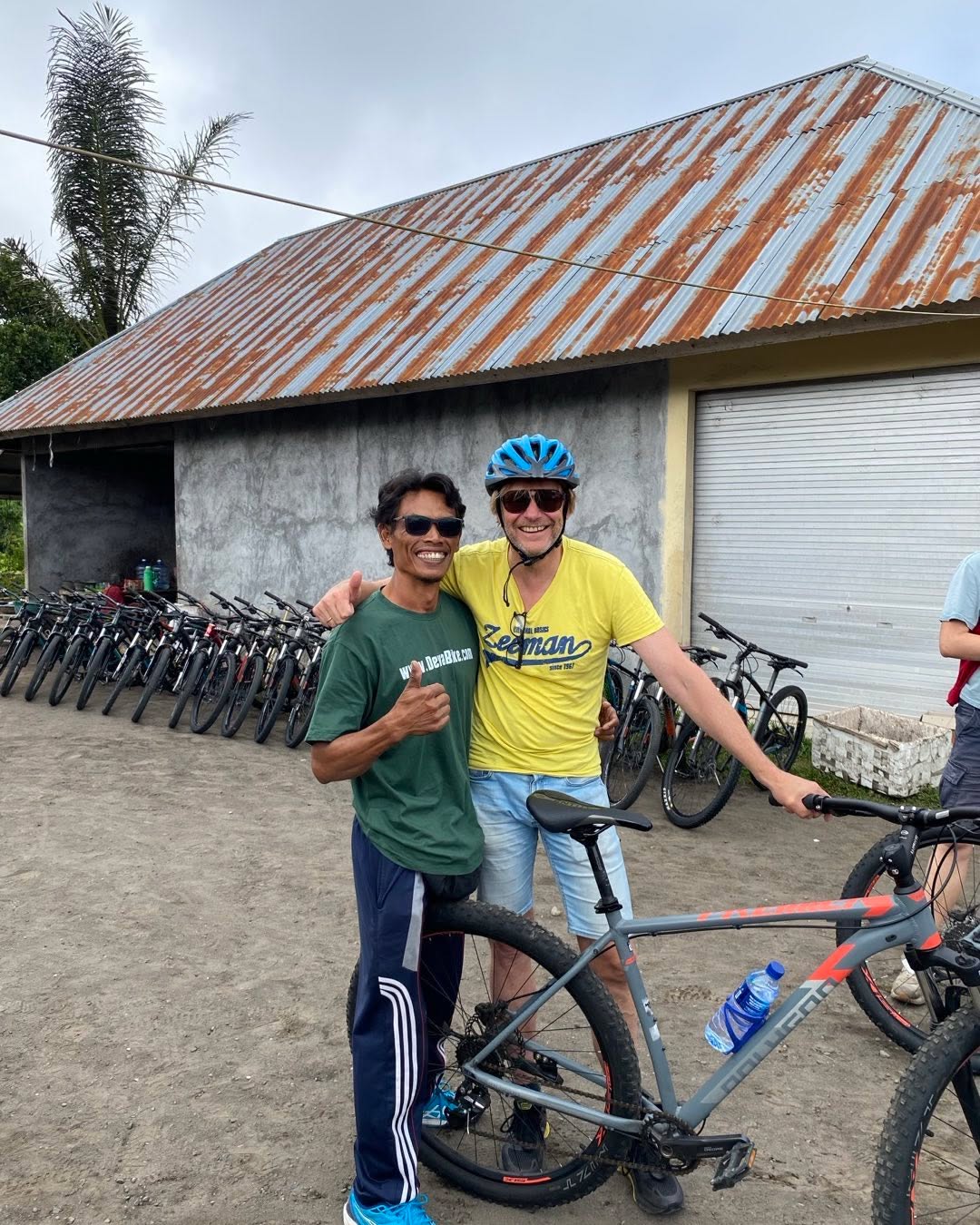 Pak Dewa and guest with mountain bikes