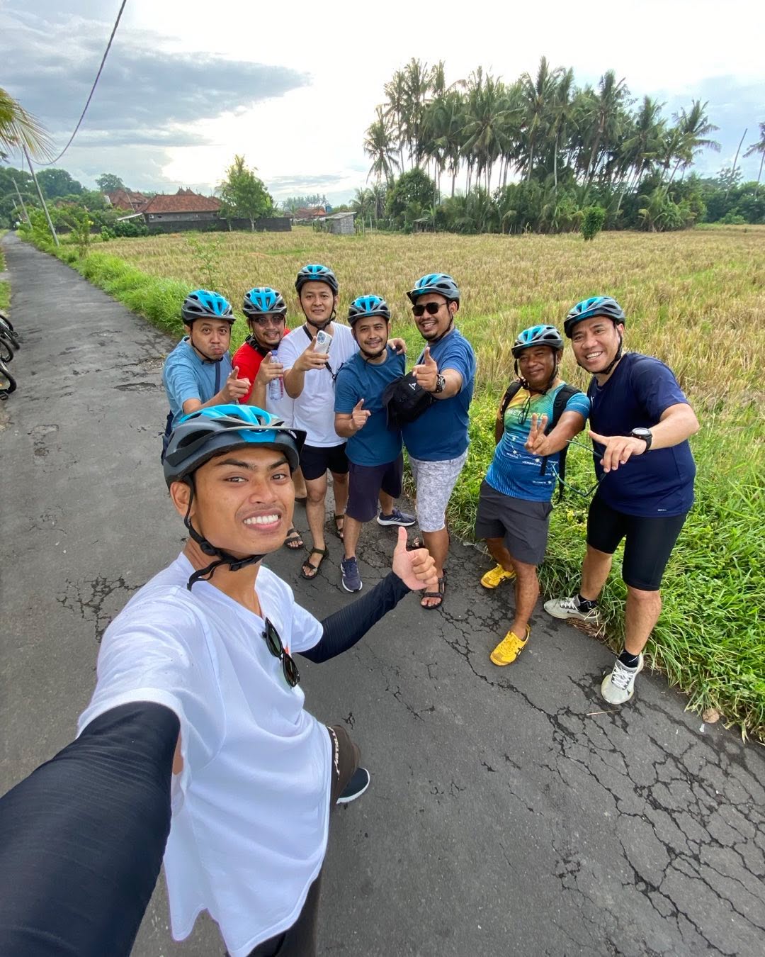 Cheerful group selfie on Ubud cycling trail